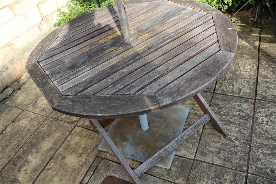 A teak garden table and parasol. - Image 2 of 2