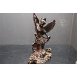 Indian wooden - possibly teak statue with wings and dagger