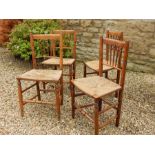 A Set of Four Matching Elm Country Kitchen Rush Seated Side Chairs, turned spindle Backs in a fan