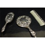 White metal backed ladies dressing set - hand mirror, brush and comb.