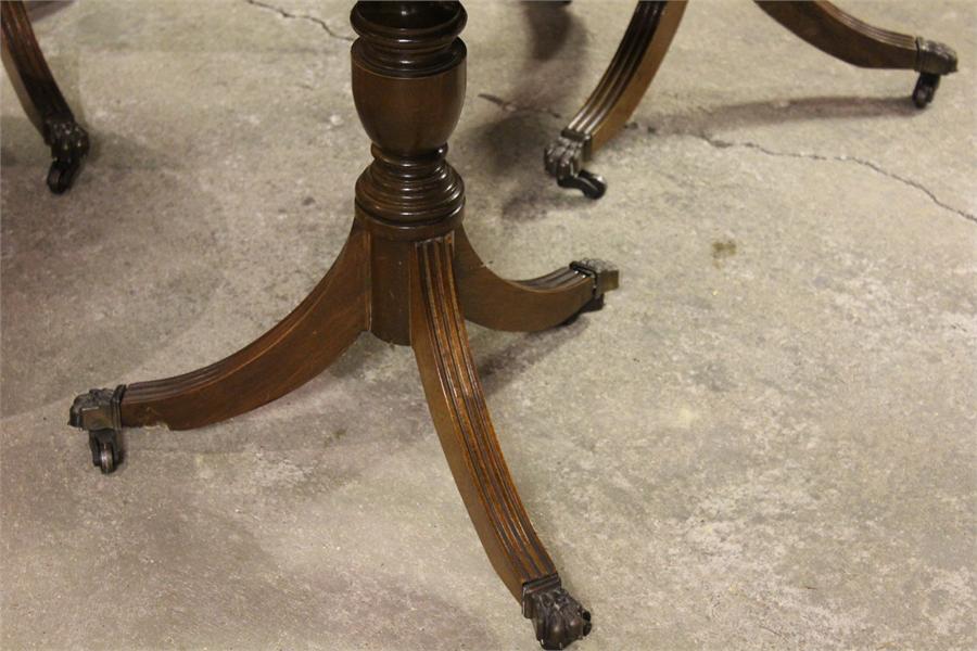 A Pair of Modern leather topped pedestal coffee tables, with brass paw castors (one foot detached on - Image 3 of 4