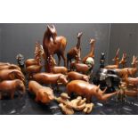 a large quantity of carved African style wooden animals some of good quality - 2 stone carved