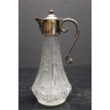A glass and plated / silver plate topped claret jug with face as spout - hinged lid