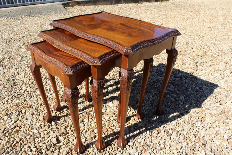 Nest of three 20th century walnut tables