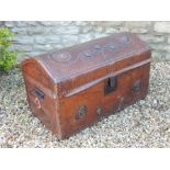 Leather clad brass studded dometop trunk.