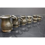 Seven pewter tankards and measures of baluster shaped form - three stamped James Yates (2no. 1/2