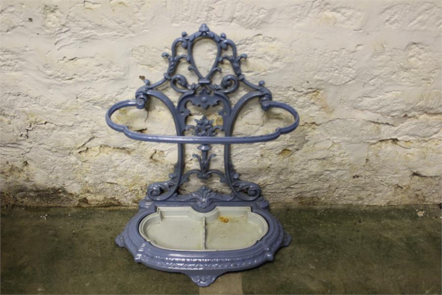 A decorative blue and cream enameled french style cast metal stick stand, with removable tray