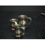 Three graduating pewter measures - crown and rose cast pewter