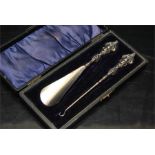 a victorian ladies set with a silver plated boot hook and a shoe horn in fine condition