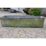 A Large weathered galvanised riveted water trough / garden planter