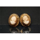 a pair of clip on vintage Cameo earrings in yellow metal mount