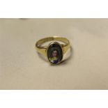 George III 18th century gold and painted sweetheart ring panel depicting portrait of a young girl.