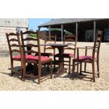 Vintage Ercol dining set inc a refectory table and five chairs, one a carver.