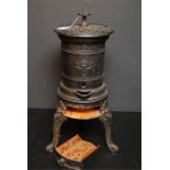 Late 19th century cast iron circular stove.