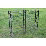 A wrought iron wine rack - black painted.