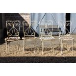 Four iron garden chairs