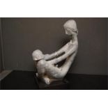 Austin Prod Inc 1970 grey resin sculpture of woman and child.