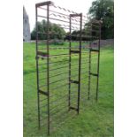 A large wrought iron wine cellar rack.