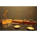 Parts of three brass balance scales and weights - none complete and one remounted, one with