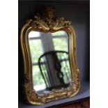 A gold painted dressing table mirror, cherub head to top.