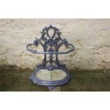 A decorative blue and cream enameled french style cast metal stick stand, with removable tray