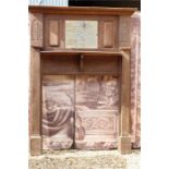 A large early 20th century oak fire surround chimney piece with carved floral nouveau motif and