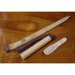Three various vintage bone items including a New Guinea implement