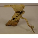 Japanese antique carved ivory bird on a branch, C1920. NB this item may not be exported.