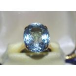 Gold and aquamarine ring marked 18K with silver re-sizer, weight: 9.29 grams, size: L/5-6