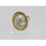 Silver gilt and blue stone ring stone testing suggests aquamarine, size: approx R/8