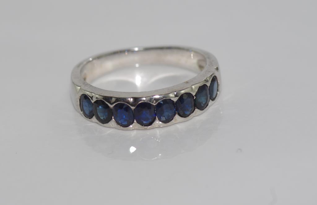 Silver and 8 blue sapphire ring size: O/7