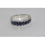 Silver and 8 blue sapphire ring size: O/7