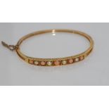 14ct gold pearl and coral bangle weight: approx 10.95 grams