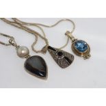 Three silver necklaces and pendants