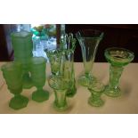 Nine assorted green glass vases including depression glass