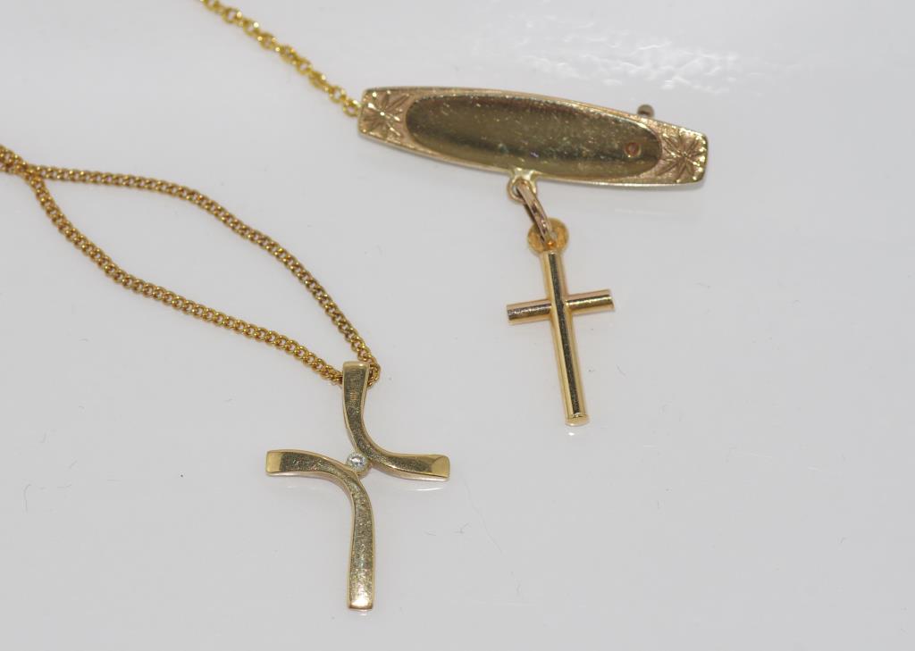 9ct yellow cross with diamond on plated chain together with a 9ct gold brooch with cross, total