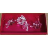 Three various Swarovski Crystal flowers including a rose, with original boxes