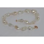 Well matched baroque pearl necklace with 9ct rose gold bolt ring clasp, 46cm long approx