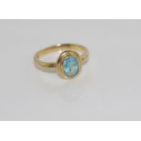 9ct yellow gold and blue stone ring weight: approx 2.6 grams, size O/7