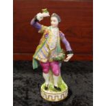 Fine quality Meissen style figure of a man with flowers, 18cm high.