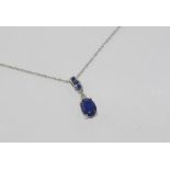 10ct white gold and sapphire pendant with chain, weight: approx 1.2 grams