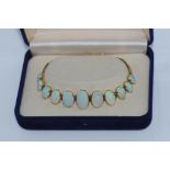 9ct yellow gold, eleven graduated opal bracelet weight: approx 8.5 grams, 9 opals well matched,