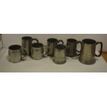 Seven antique & later pewter mugs