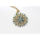 9ct blue stone pendant on gilt metal chain, weight: approx 6 grams