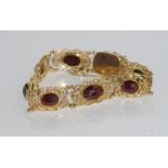 Vintage 14ct yellow gold and garnet set bracelet 8 oval flat garnets with pierced gold surrounds,