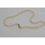 Pearl necklace with tri-colour 14ct gold clasp size: approx 39cm in length