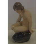 Royal Copenhagen girl on a rock figure 14cm high