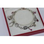 18ct white gold bracelet with charms and rubies & diamonds, weight: approx 10.5 grams