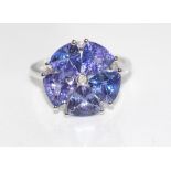 18ct white gold, tanzanite & diamond ring 5 tanzanite 4.67ct, weight: approx 4.3 grams, size: N-O/7