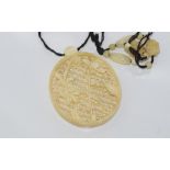 Good carved vintage ivory pendant